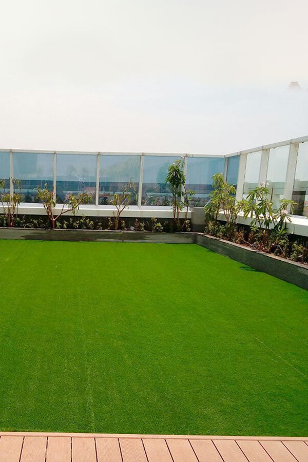 Artificial grass installed on balcony floor – low-maintenance green turf for urban living