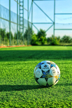 Artificial grass being installed in a garden – low-maintenance turf by PlantsWorld.ae