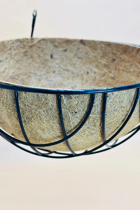 Close view of coco coir liner inside black metal hanging basket