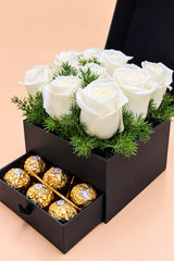 White roses in black drawer gift box with Ferrero Rocher