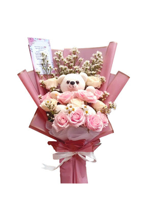 Mini cuddles flower bouquet with 8 pink roses, 8 white roses, and a small teddy bear gift arrangement