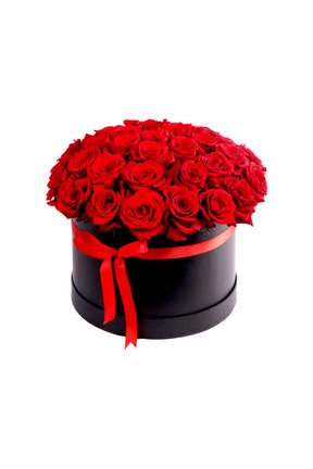 Red Roses in Black Box – stunning red roses arranged in a sleek black box, perfect for romantic occasions and elegant gifts.
